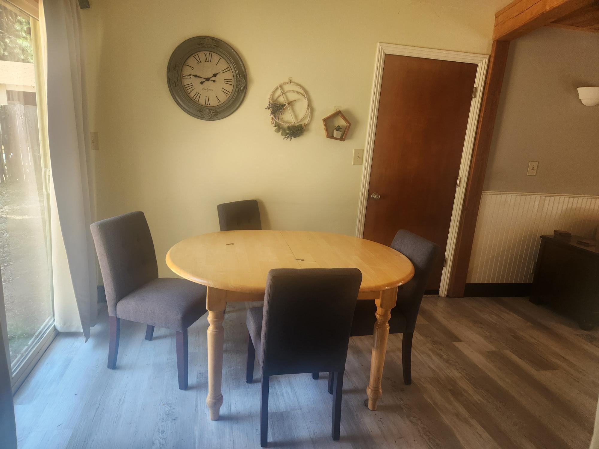 20263 Sugar Pine Street Burney, CA 96013 - Photo 4 of 22 a view of a dining room with furniture and wooden floor