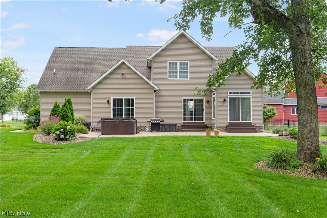 3356 Huntcliffe Road Northeast Canton, OH 44721 - Photo 17 of 50 Back of house with a patio and a yard