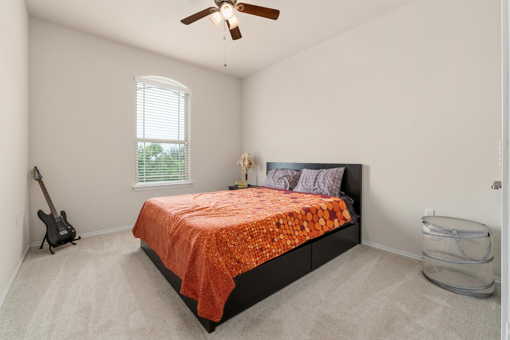 10124 Pinnacle Crest Loop Austin, TX 78747 - Photo 21 of 31 Carpeted bedroom featuring a vaulted ceiling and a ceiling fan with integrated lighting