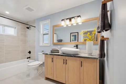 a bathroom with a toilet bathtub and shower