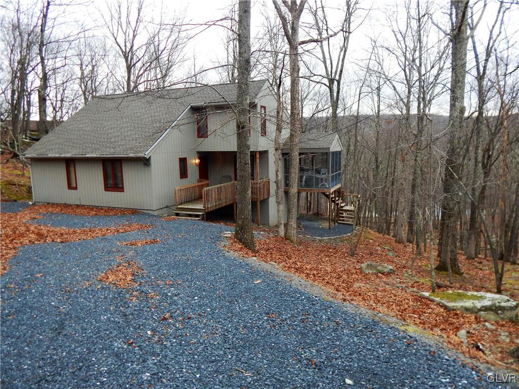174 Radcliff Road Bushkill, PA 18324 - Photo 3 of 24 a backyard of a house with barbeque oven fire pit table and chairs