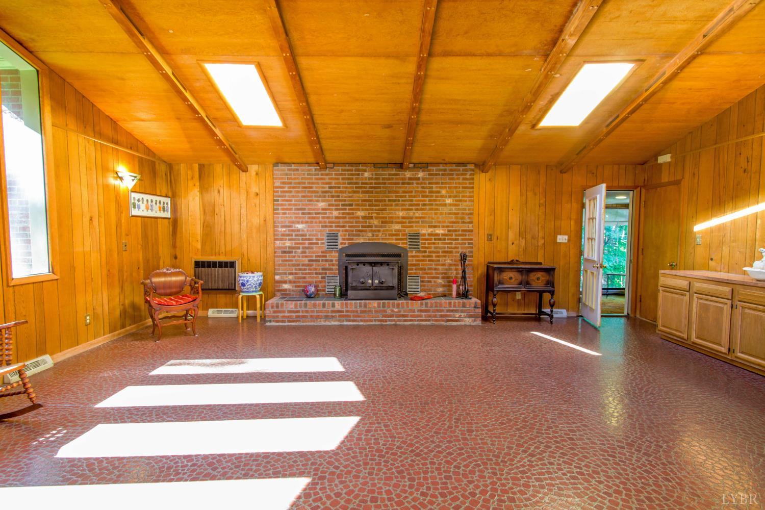 151 Clarks Road Rustburg, VA 24588 - Photo 21 of 81 a living room with furniture and a fireplace