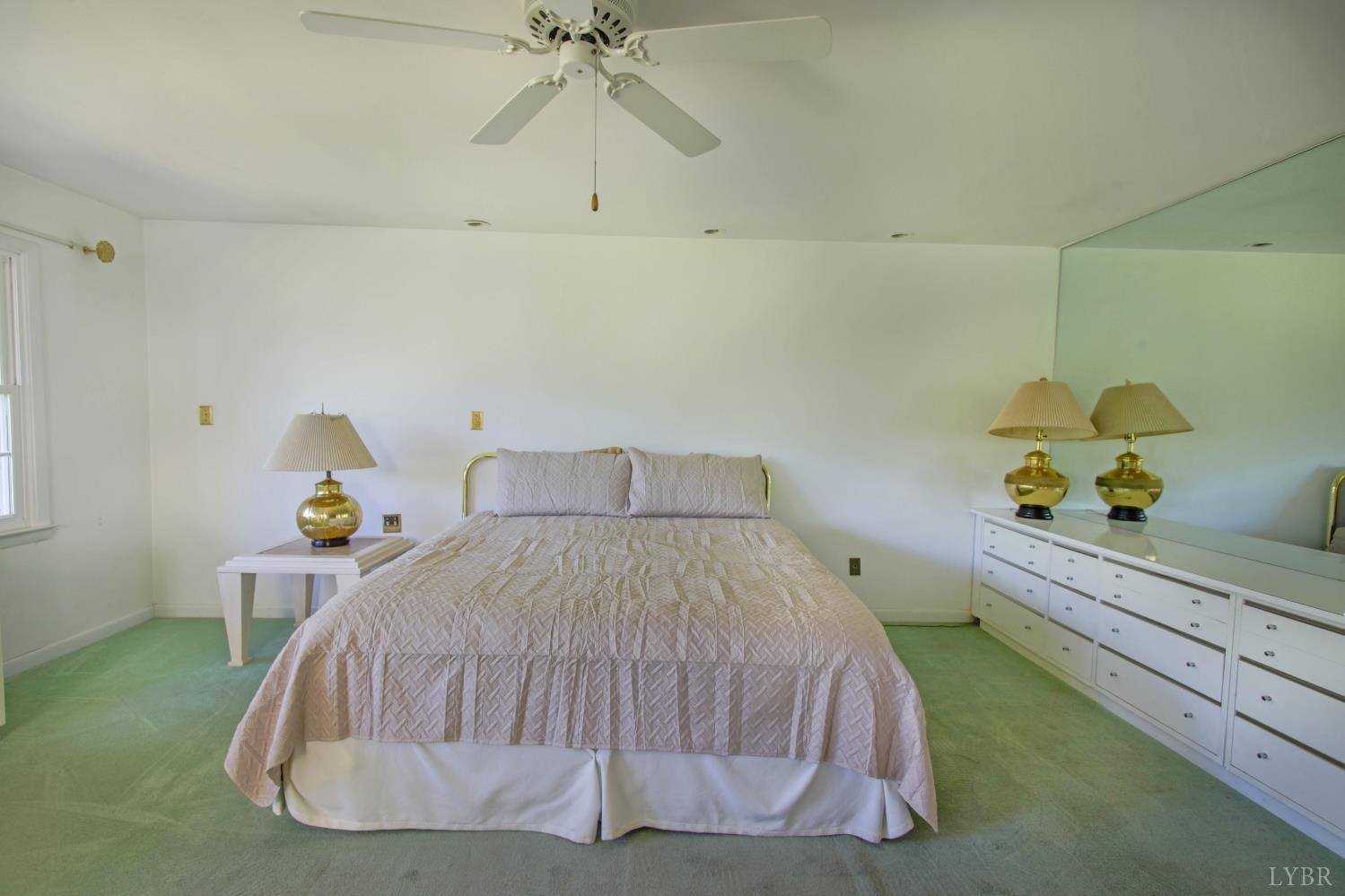 151 Clarks Road Rustburg, VA 24588 - Photo 39 of 81 a bed sitting in a bedroom next to a window