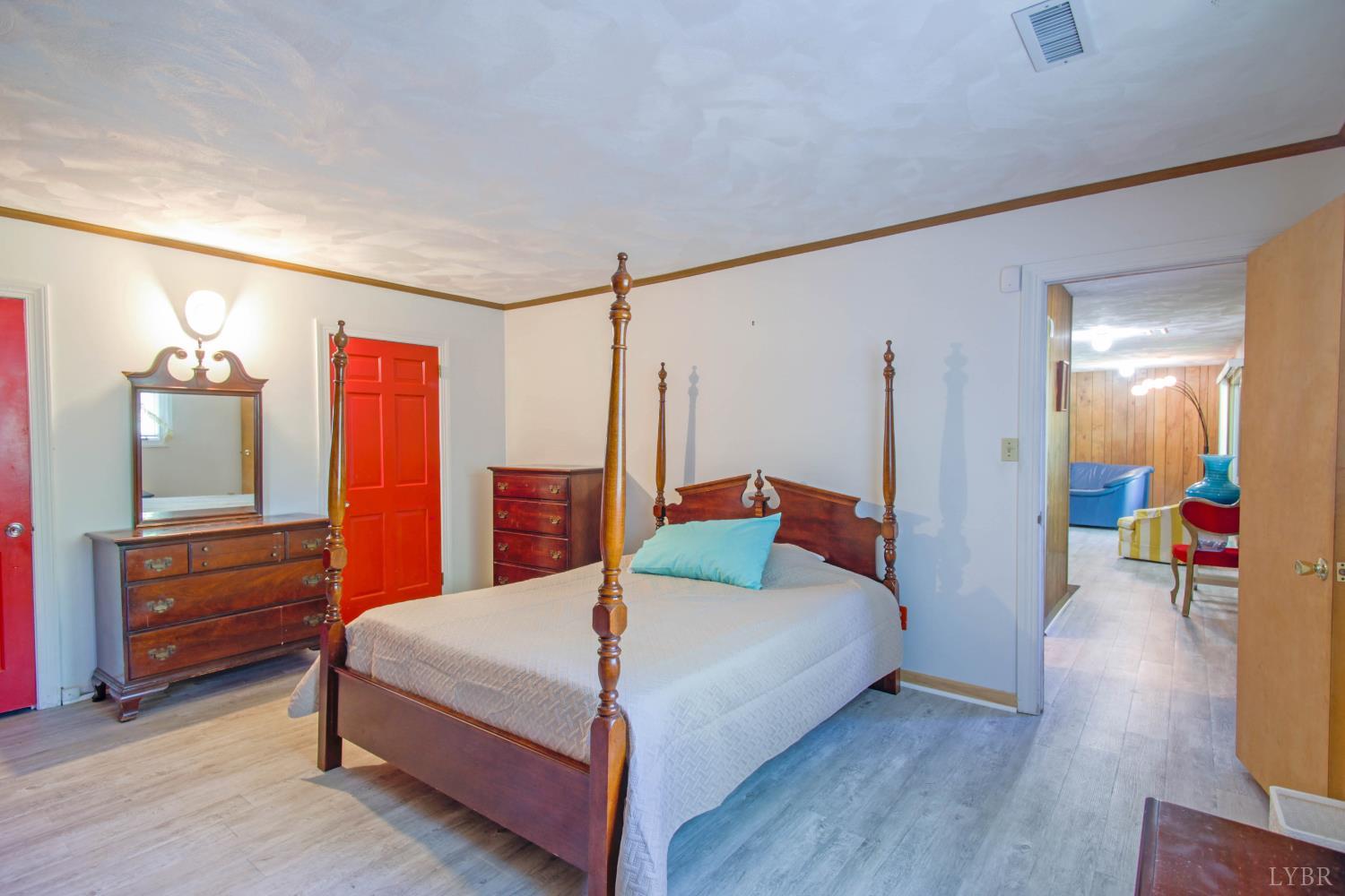 151 Clarks Road Rustburg, VA 24588 - Photo 55 of 81 a bedroom with a bed and dresser with mirror