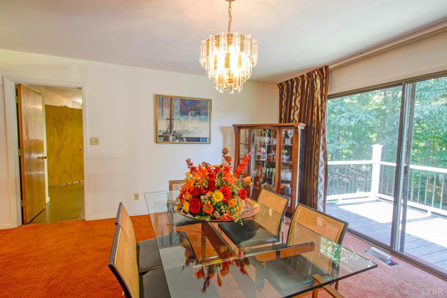 151 Clarks Road Rustburg, VA 24588 - Photo 9 of 81 a dining room with furniture a chandelier and wooden floor
