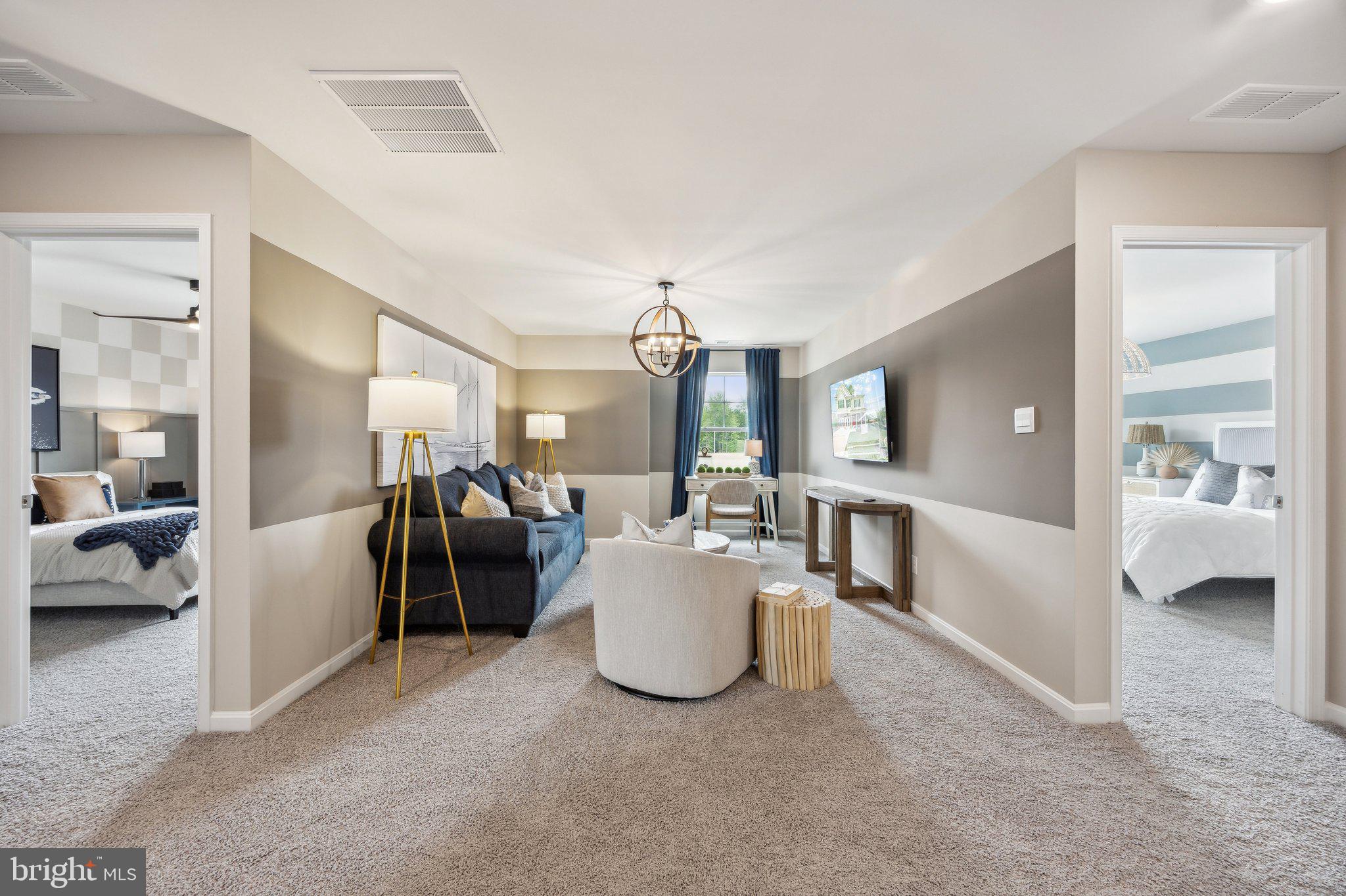 6292 Sterling Way Ruther Glen, VA 22546 - Photo 14 of 31 a living room with furniture and a chandelier