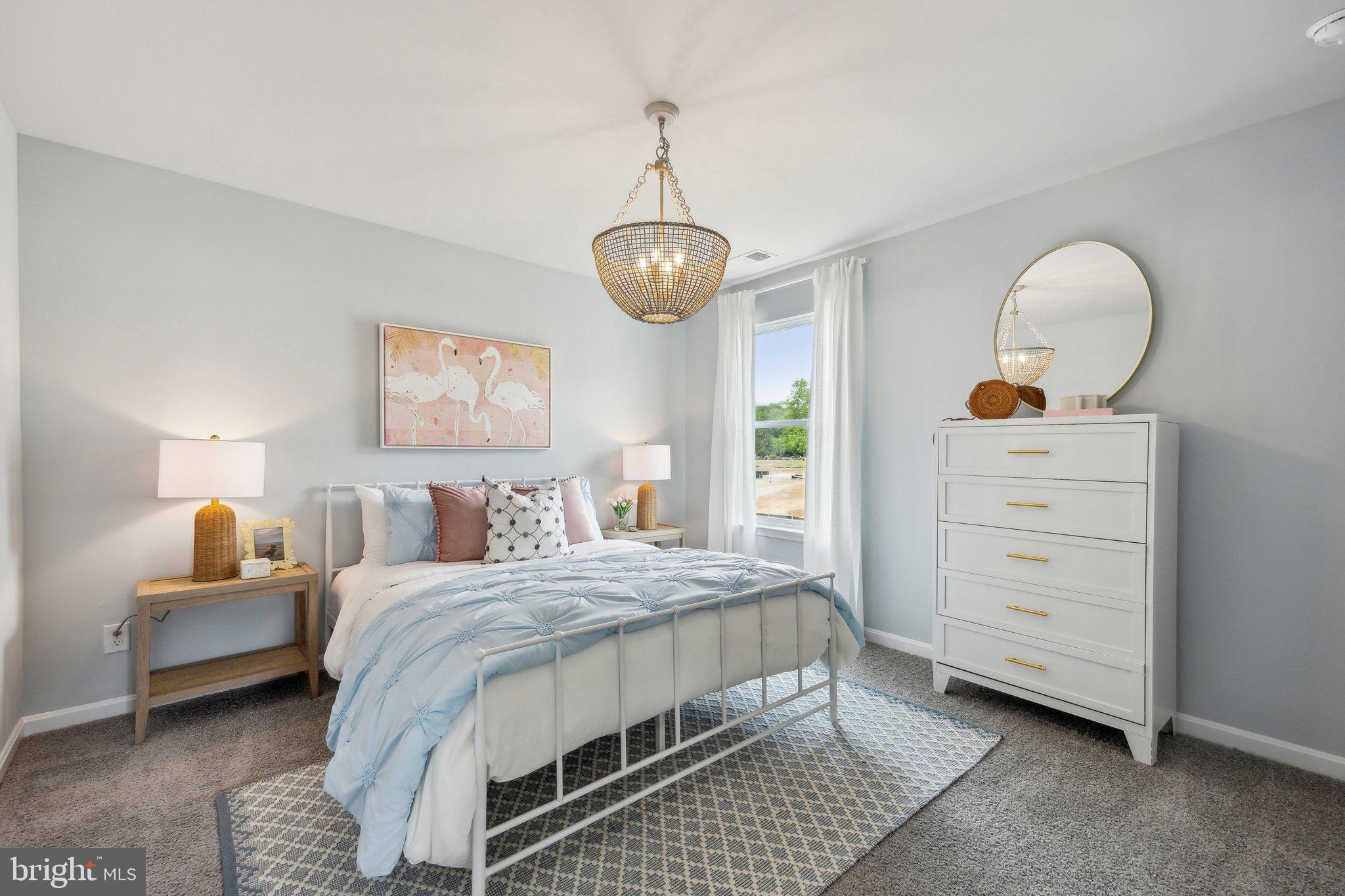 6292 Sterling Way Ruther Glen, VA 22546 - Photo 20 of 31 a bedroom with a bed and wooden floor
