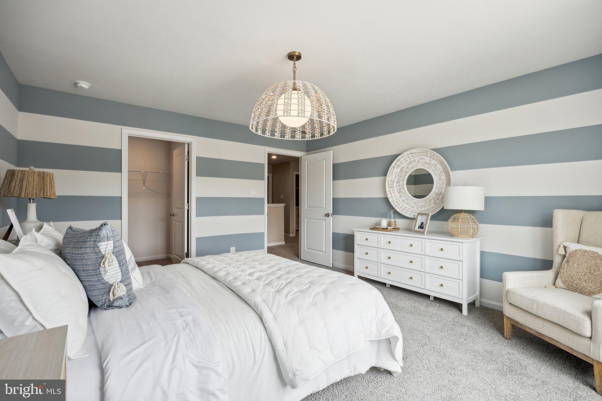 6292 Sterling Way Ruther Glen, VA 22546 - Photo 23 of 31 a bedroom with bed and a chandelier