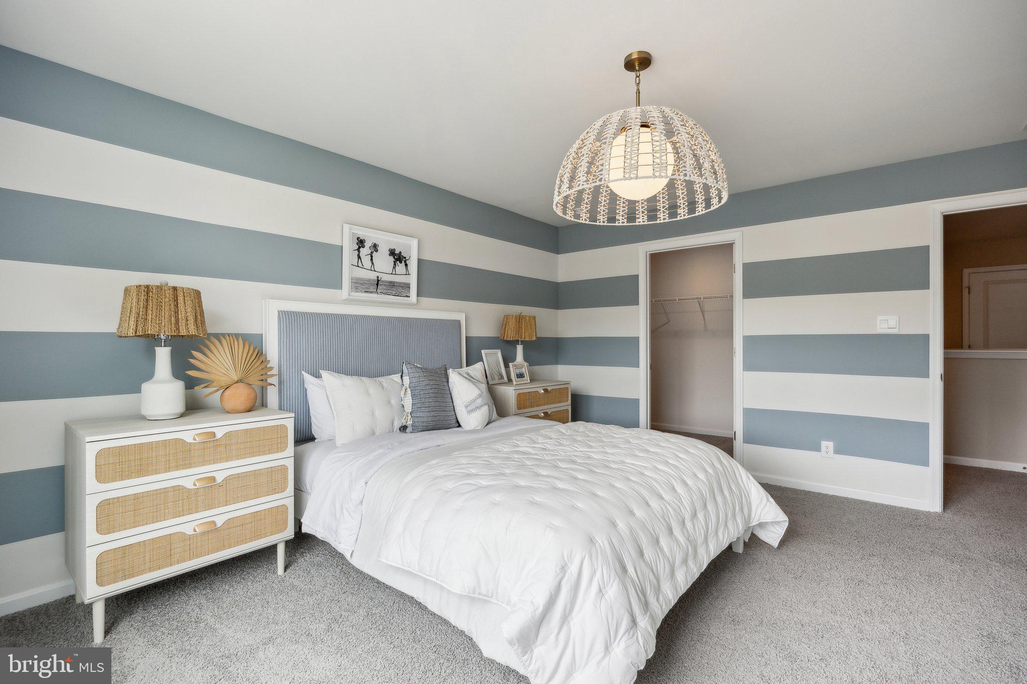 6292 Sterling Way Ruther Glen, VA 22546 - Photo 24 of 31 a bedroom with a bed and a chandelier