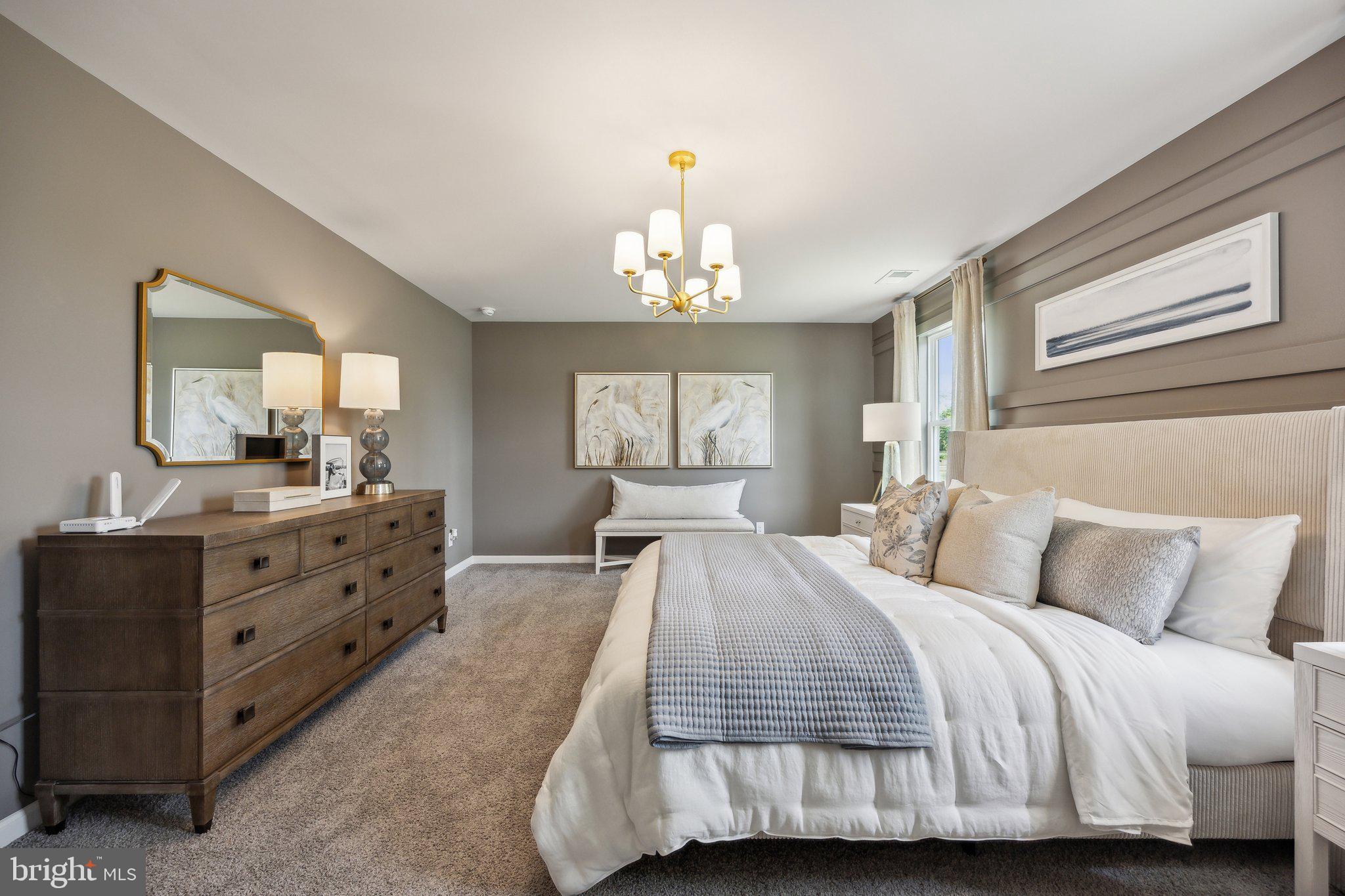 6292 Sterling Way Ruther Glen, VA 22546 - Photo 28 of 31 a bedroom with a bed and a chandelier