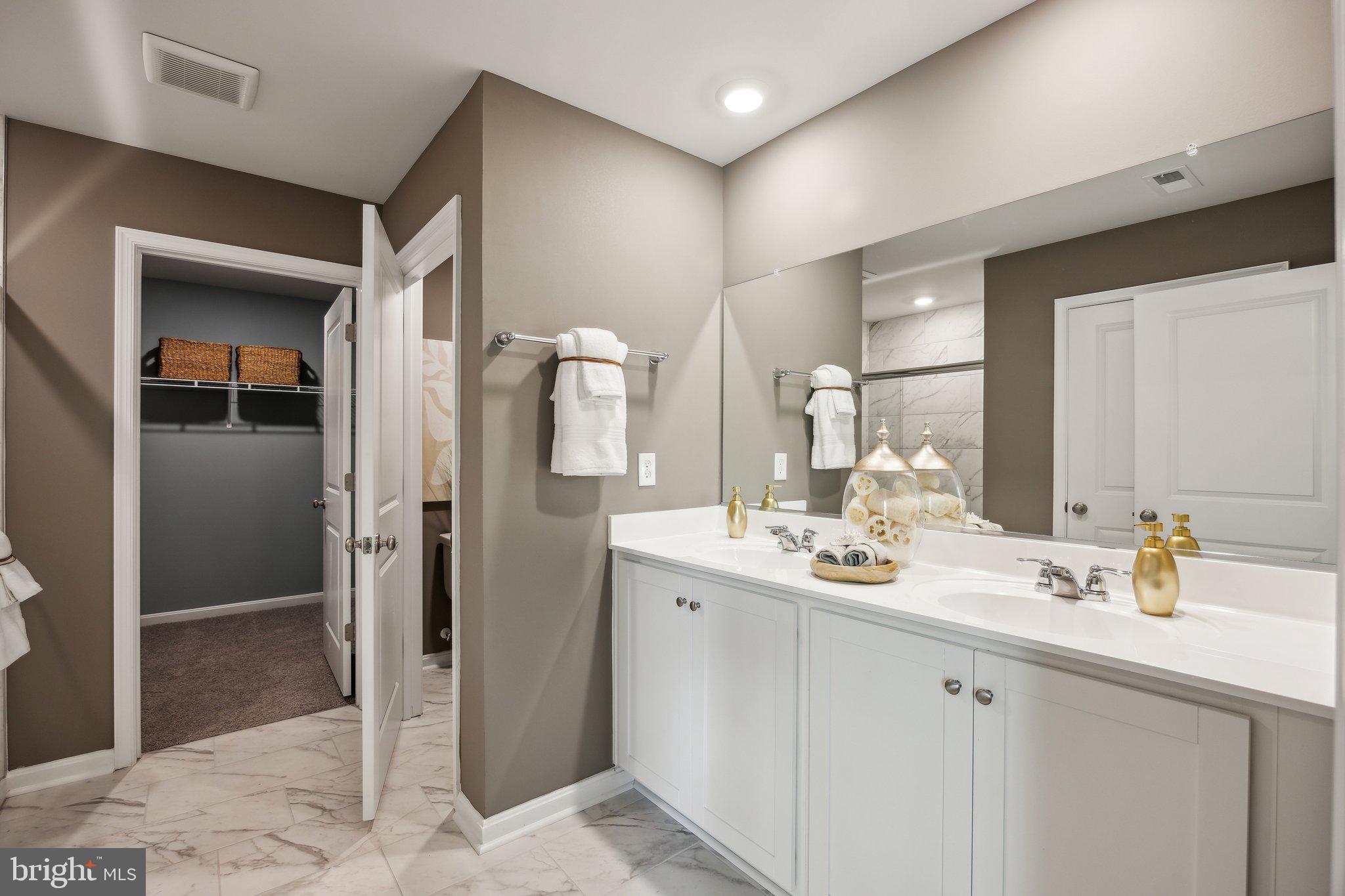 6292 Sterling Way Ruther Glen, VA 22546 - Photo 29 of 31 a bathroom with a sink and a mirror
