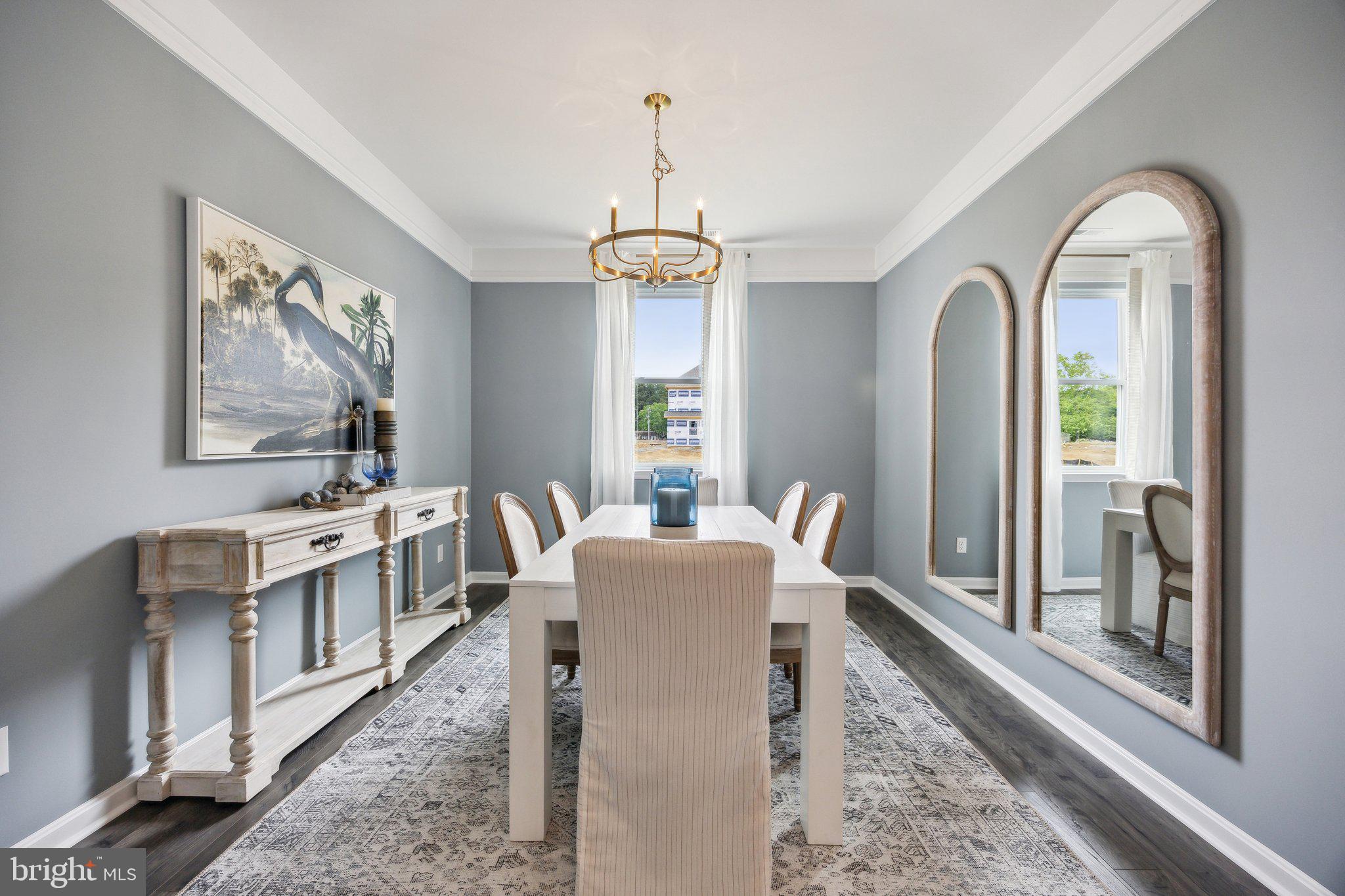 6292 Sterling Way Ruther Glen, VA 22546 - Photo 3 of 31 a dining room with furniture a chandelier and wooden floor