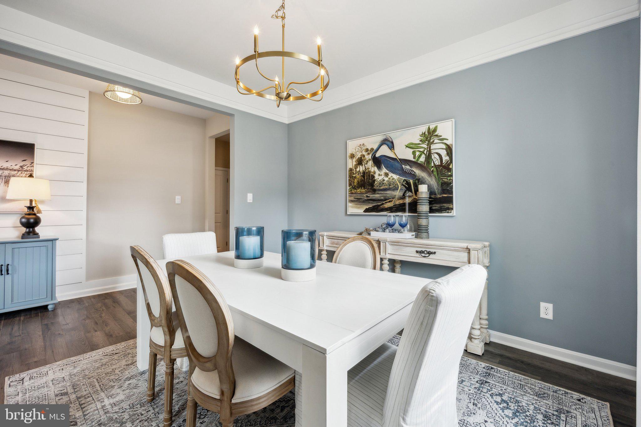 6292 Sterling Way Ruther Glen, VA 22546 - Photo 4 of 31 a view of a dining room with furniture and wooden floor