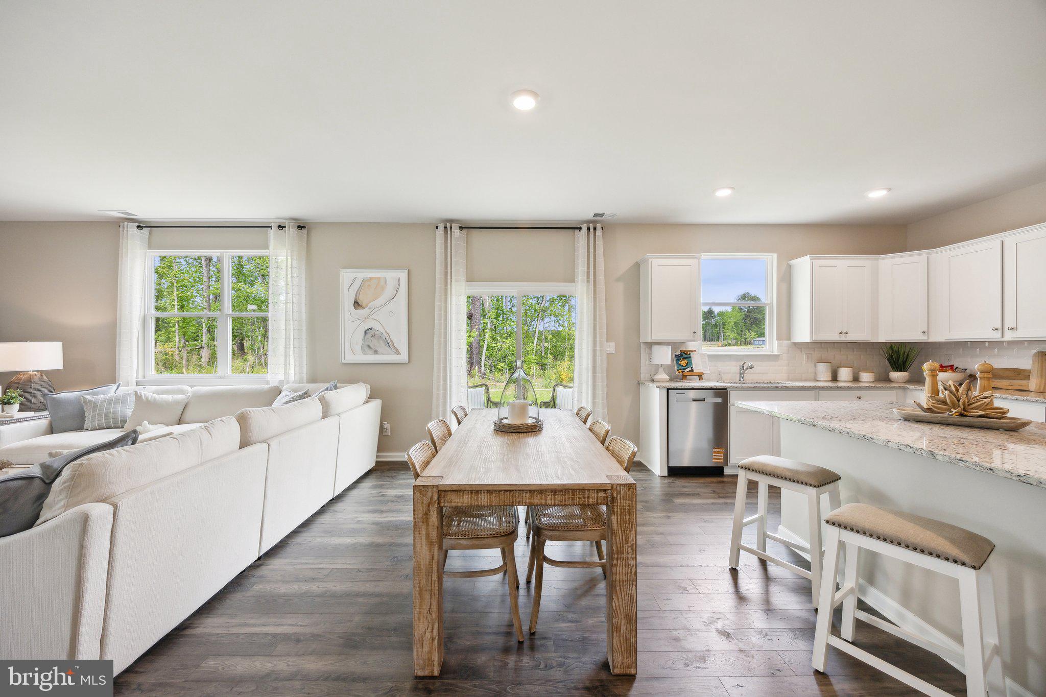 6292 Sterling Way Ruther Glen, VA 22546 - Photo 5 of 31 a kitchen with a table chairs stove and cabinets