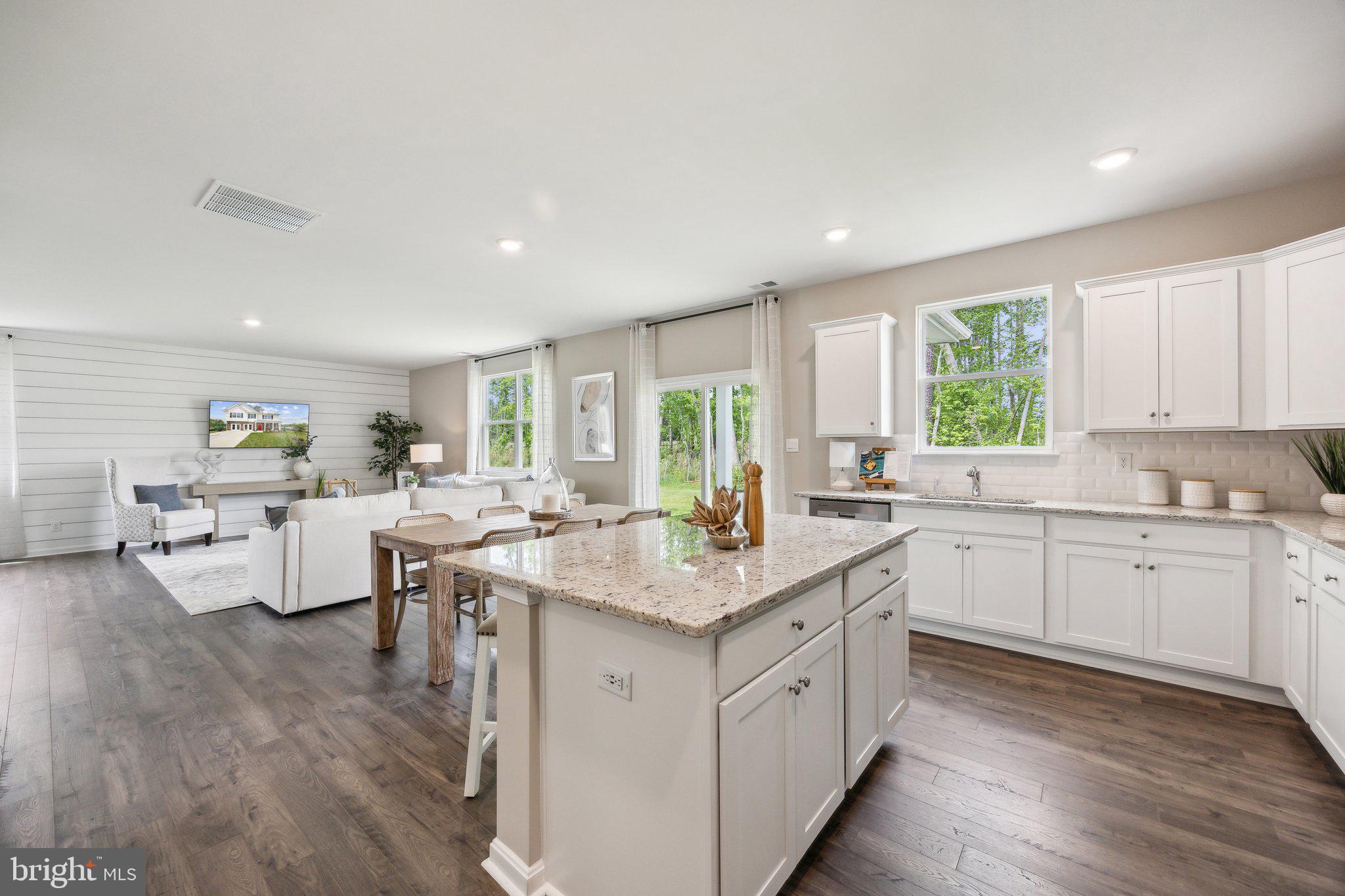 6292 Sterling Way Ruther Glen, VA 22546 - Photo 6 of 31 a kitchen with center island table and chairs