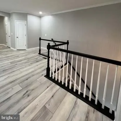 a view of hallway with wooden floor