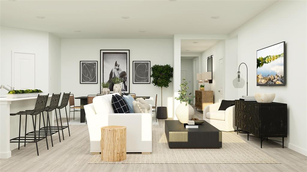 14937 Reyes Road Little Elm, TX 75068 - Photo 19 of 20 Living area featuring light wood-style floors and baseboards