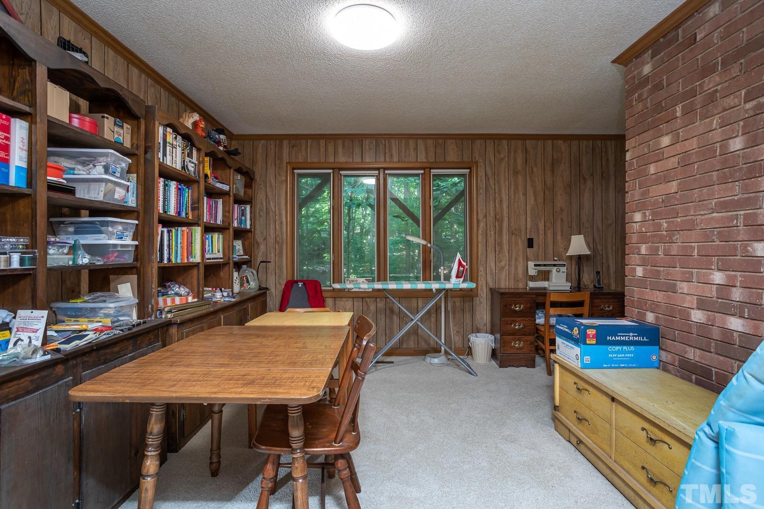 14401 Possum Track Road Raleigh, NC 27614 - Photo 18 of 30 a room with furniture pool table and a large window