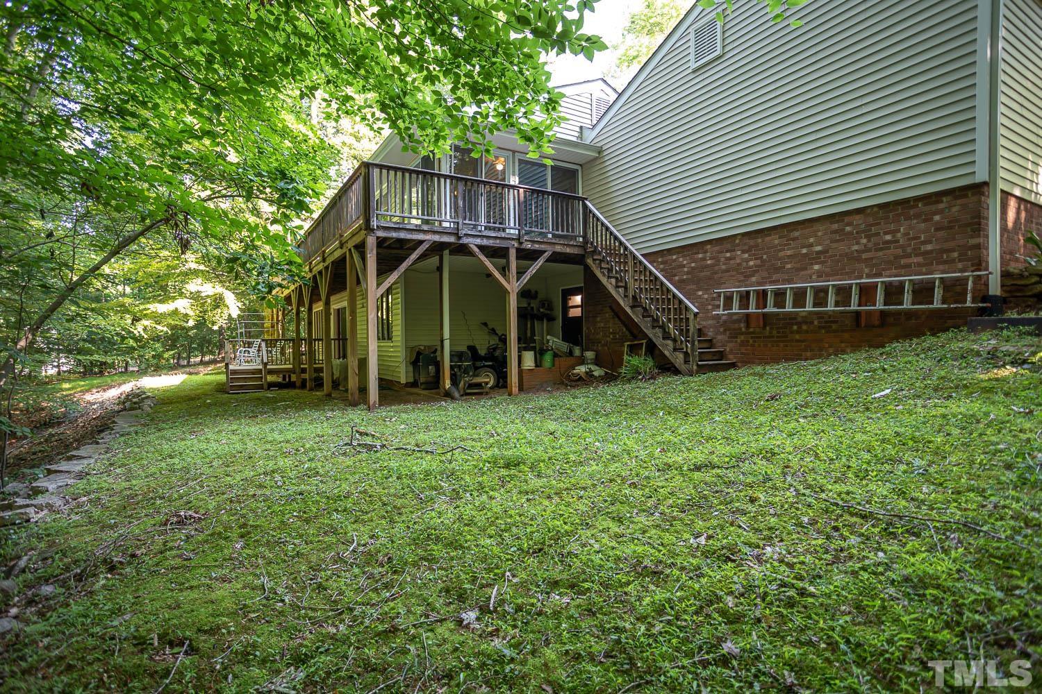 14401 Possum Track Road Raleigh, NC 27614 - Photo 21 of 30 a view of a house with backyard and entertaining space