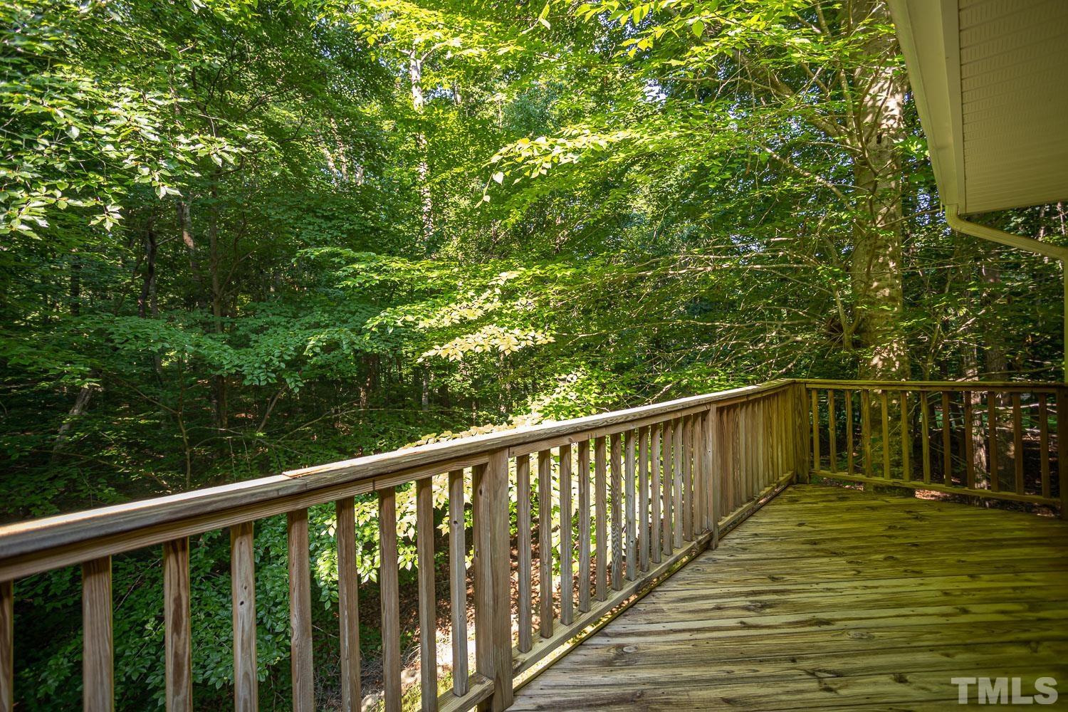 14401 Possum Track Road Raleigh, NC 27614 - Photo 23 of 30 a balcony with trees in front of it
