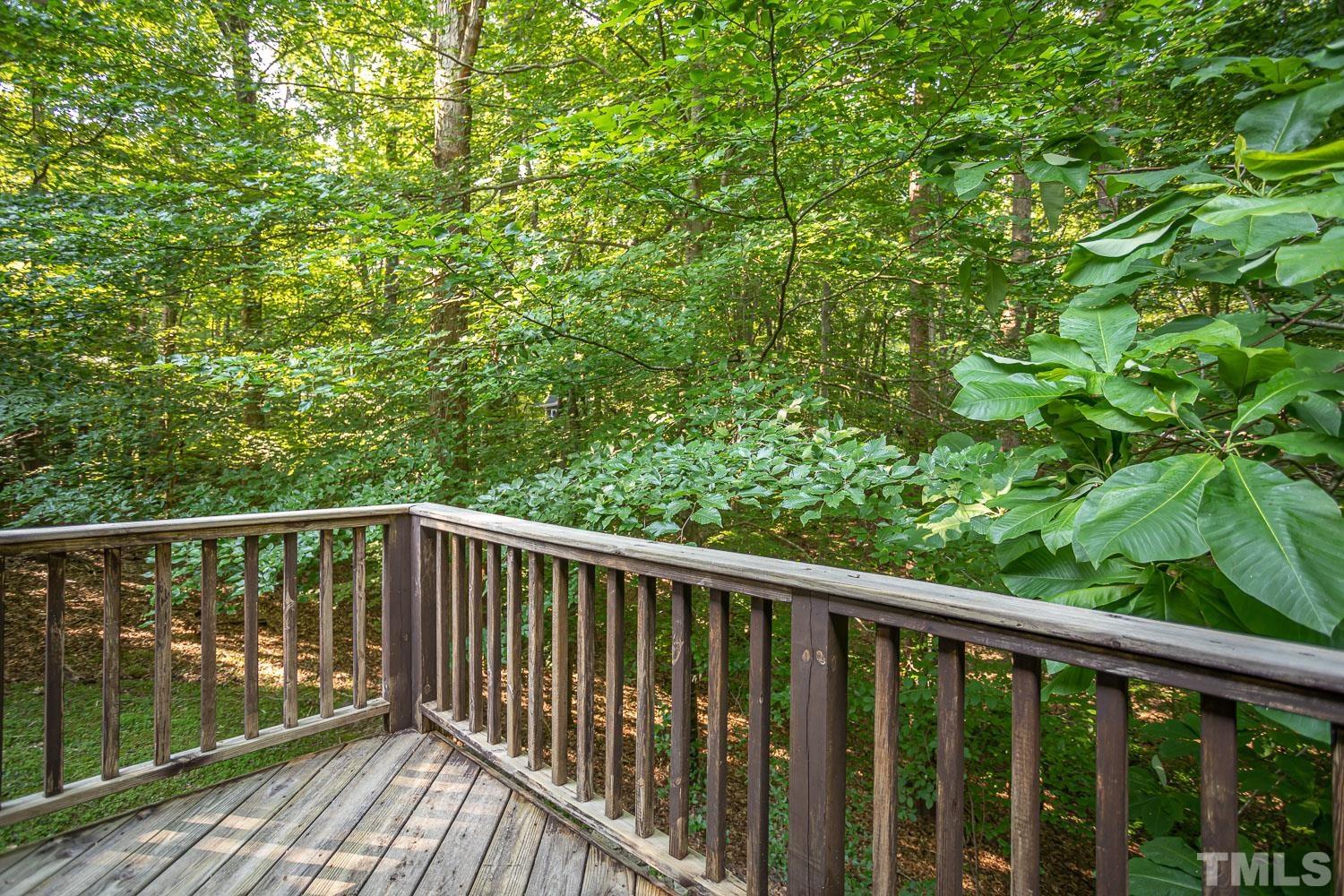 14401 Possum Track Road Raleigh, NC 27614 - Photo 25 of 30 a balcony with wooden floor and yard