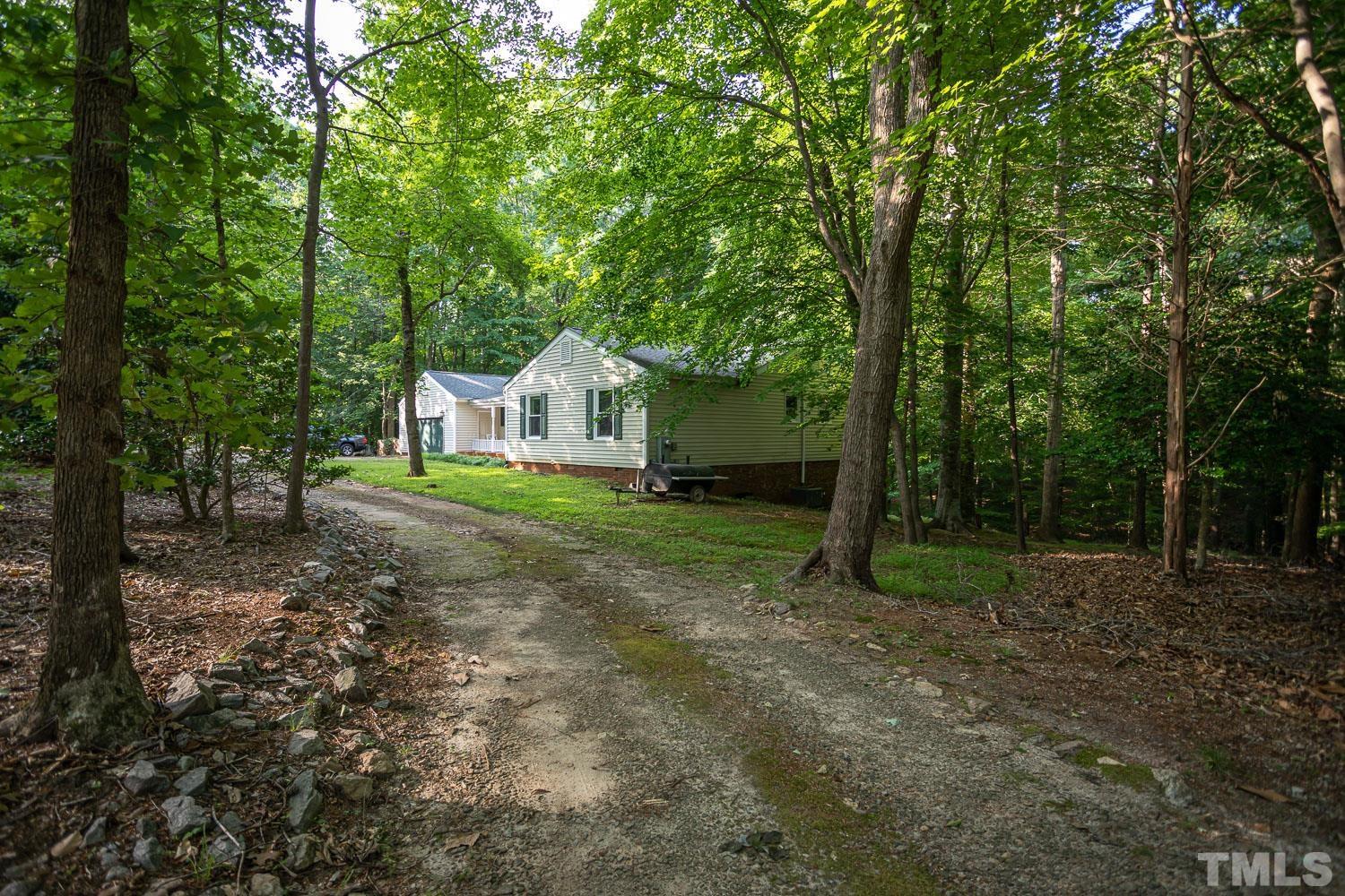 14401 Possum Track Road Raleigh, NC 27614 - Photo 27 of 30 a view of an house with backyard space and garden