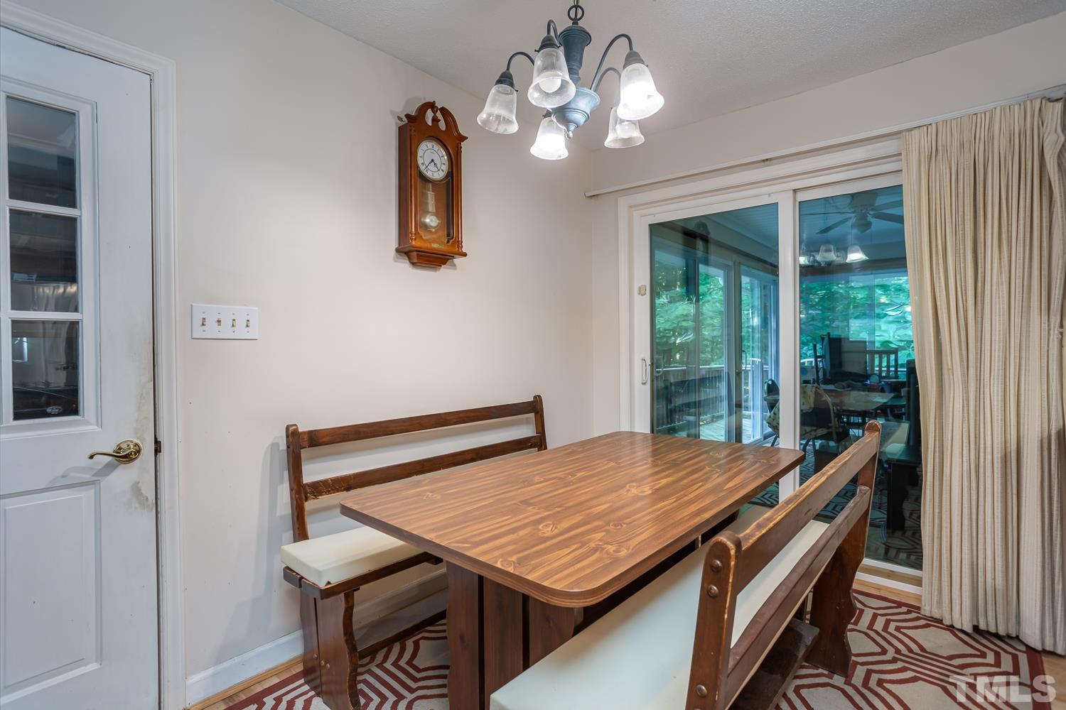 14401 Possum Track Road Raleigh, NC 27614 - Photo 10 of 30 a view of a dining room with furniture window and outside view