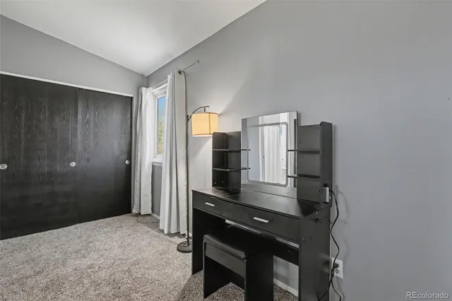 a kitchen with a refrigerator and cabinets
