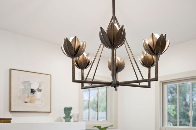 a kitchen with stainless steel appliances granite countertop a stove top oven a sink a refrigerator and white cabinets