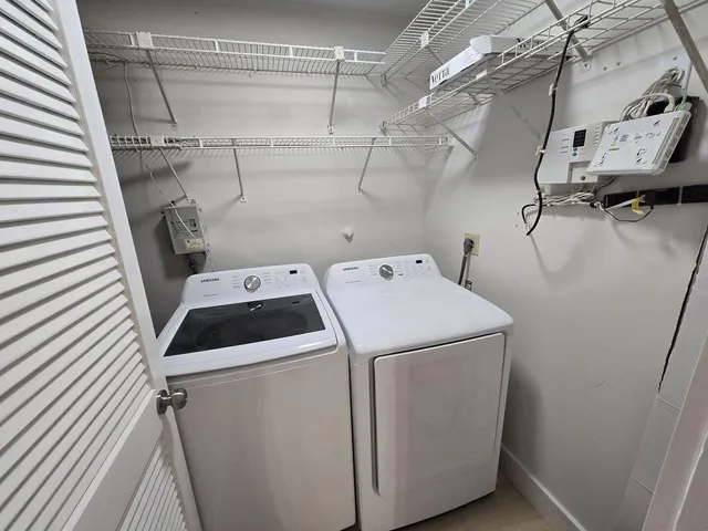a utility room with dryer and washer