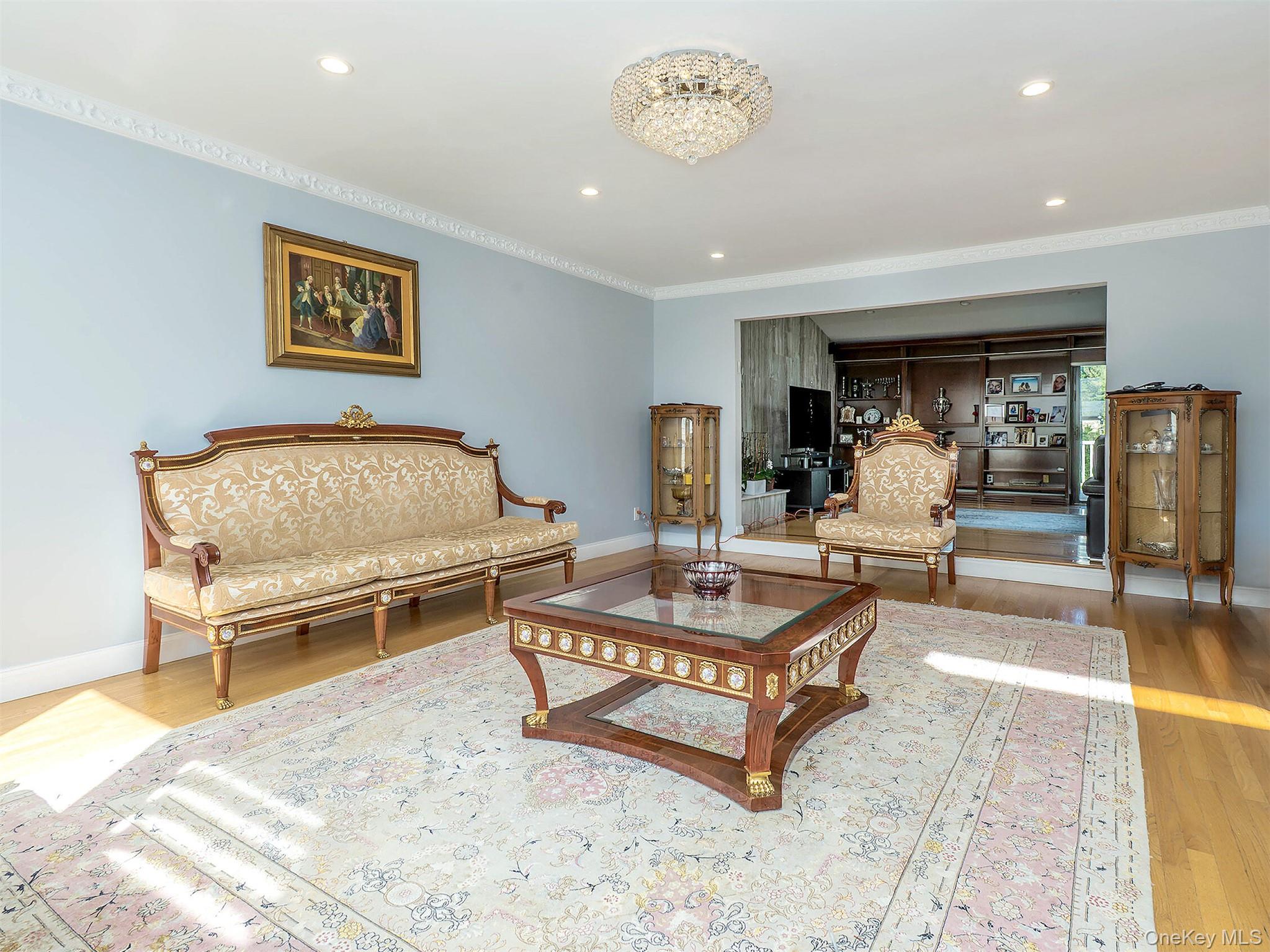 32 Carriage Road Great Neck, NY 11024 - Photo 11 of 33 a living room with a couch and a table