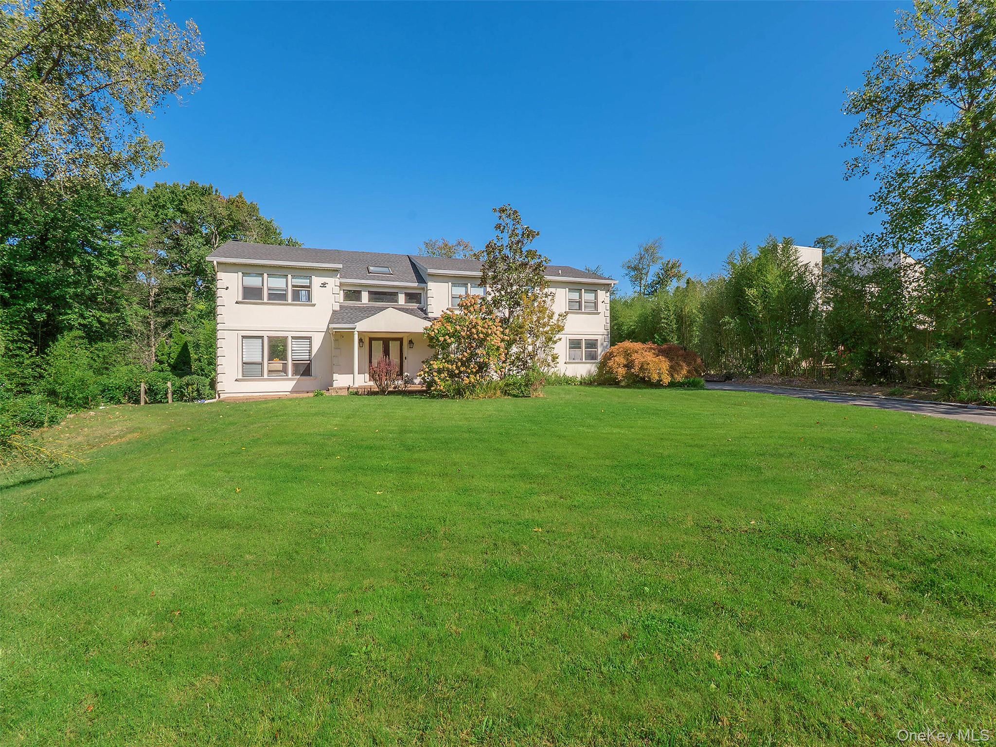 32 Carriage Road Great Neck, NY 11024 - Photo 30 of 33 a view of a house with a yard