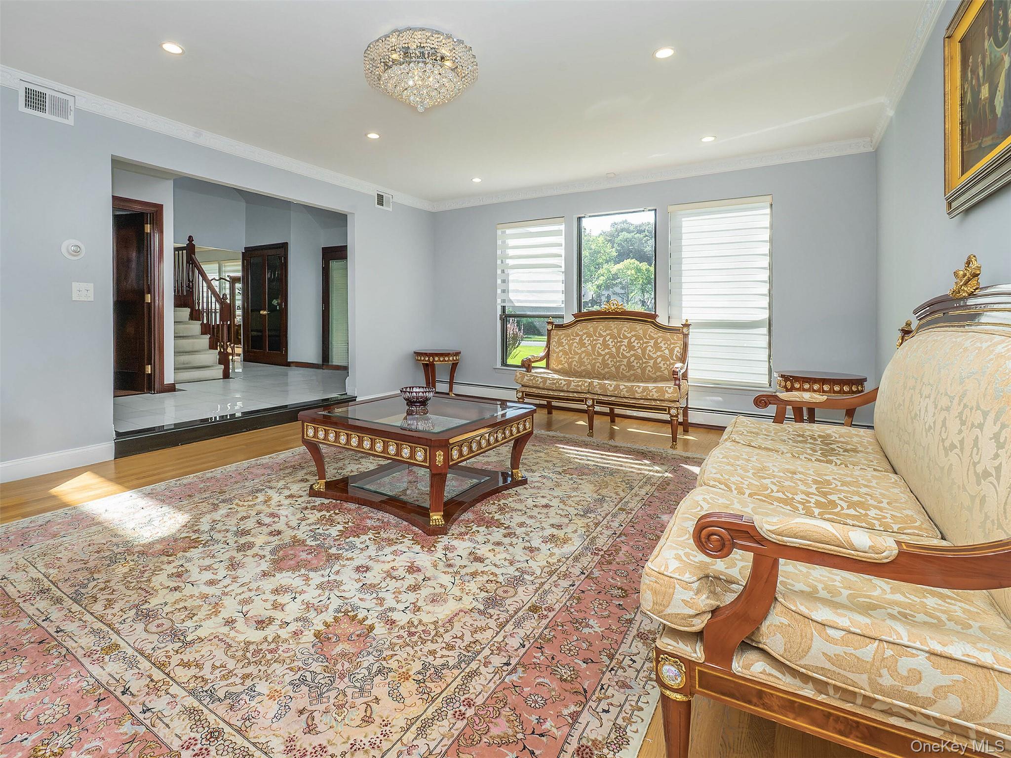 32 Carriage Road Great Neck, NY 11024 - Photo 9 of 33 a living room with furniture and a table