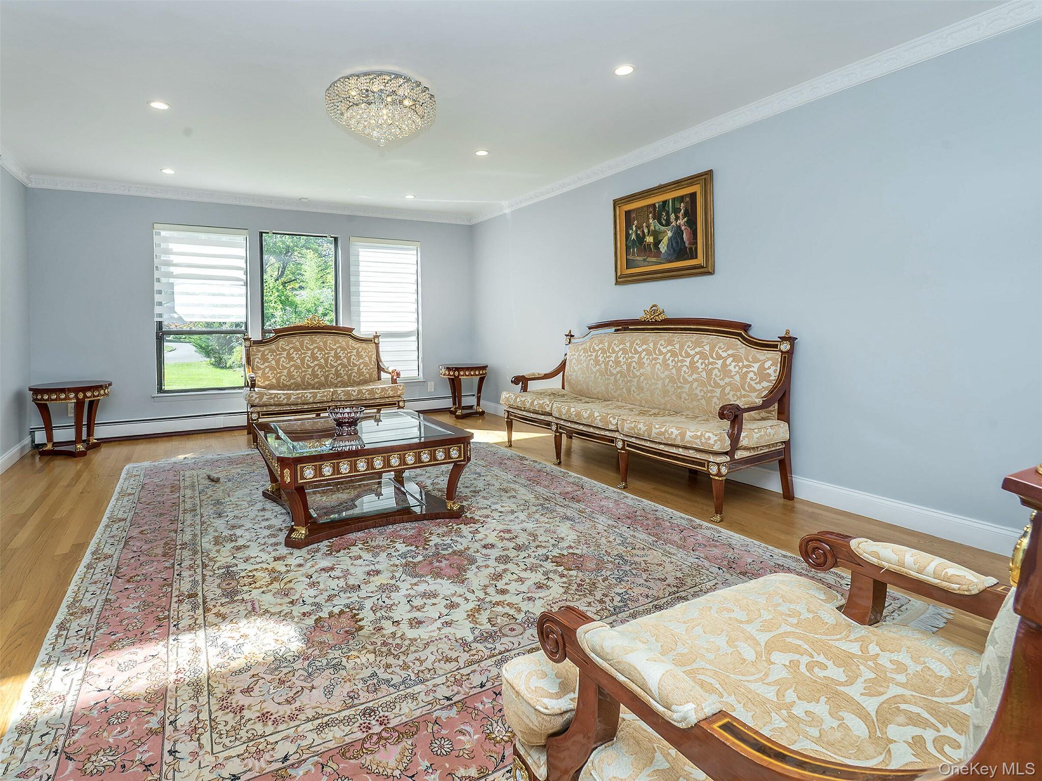 32 Carriage Road Great Neck, NY 11024 - Photo 10 of 33 a living room with furniture and a table