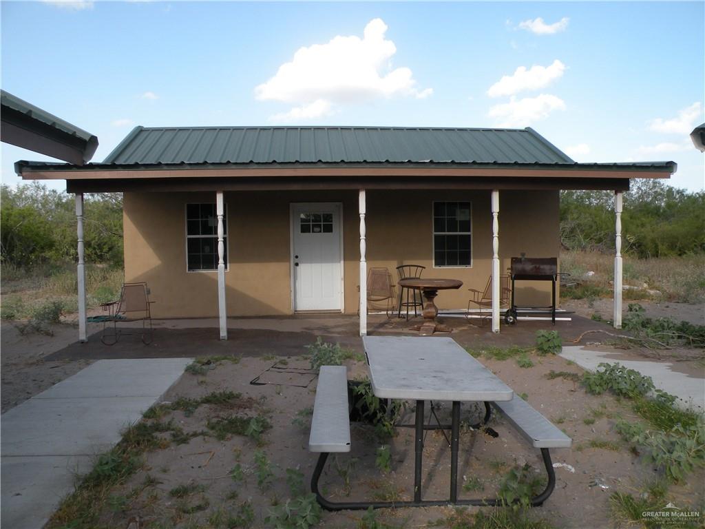 0 Fm 1017 Highway Hebbronville, TX 78361 - Photo 2 of 20 a view of a dinning table and chairs in patio of the house