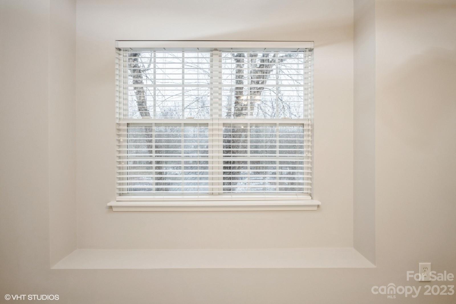 8334 Rudolph Road Charlotte, NC 28216 - Photo 19 of 31 a bathroom with a window and a shower