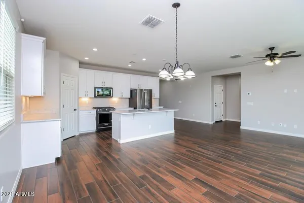 a view of a kitchen with electric appliances