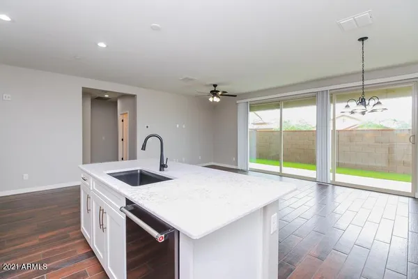 a kitchen that has a sink and a large window