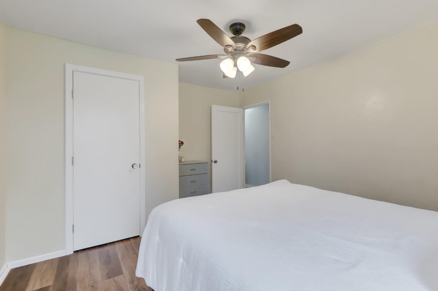11625 Tyler Foote Road Nevada City, CA 95959 - Photo 23 of 96 a bedroom with a large bed and wooden floor