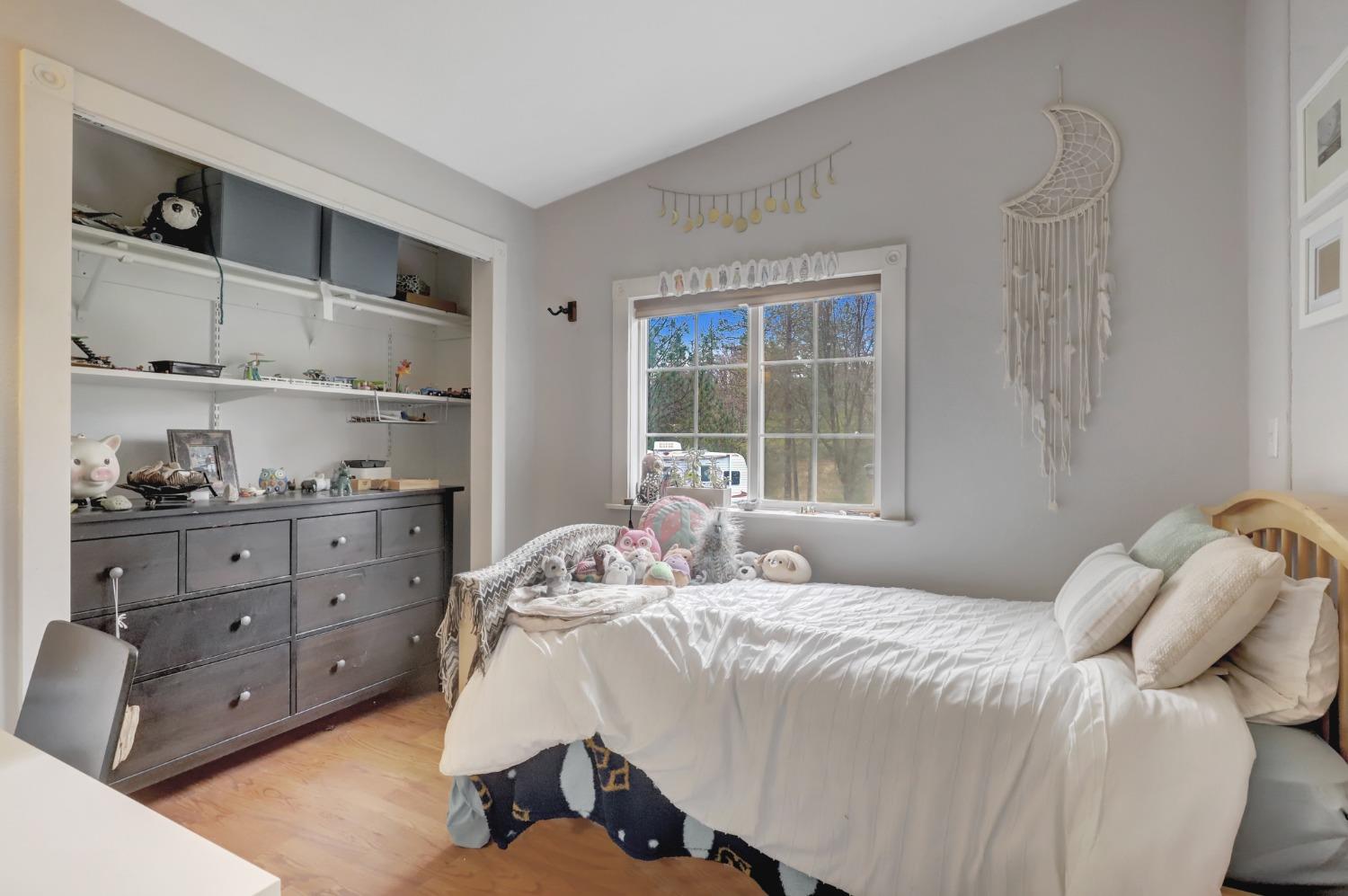 11625 Tyler Foote Road Nevada City, CA 95959 - Photo 54 of 96 a bedroom with a bed and wooden floor