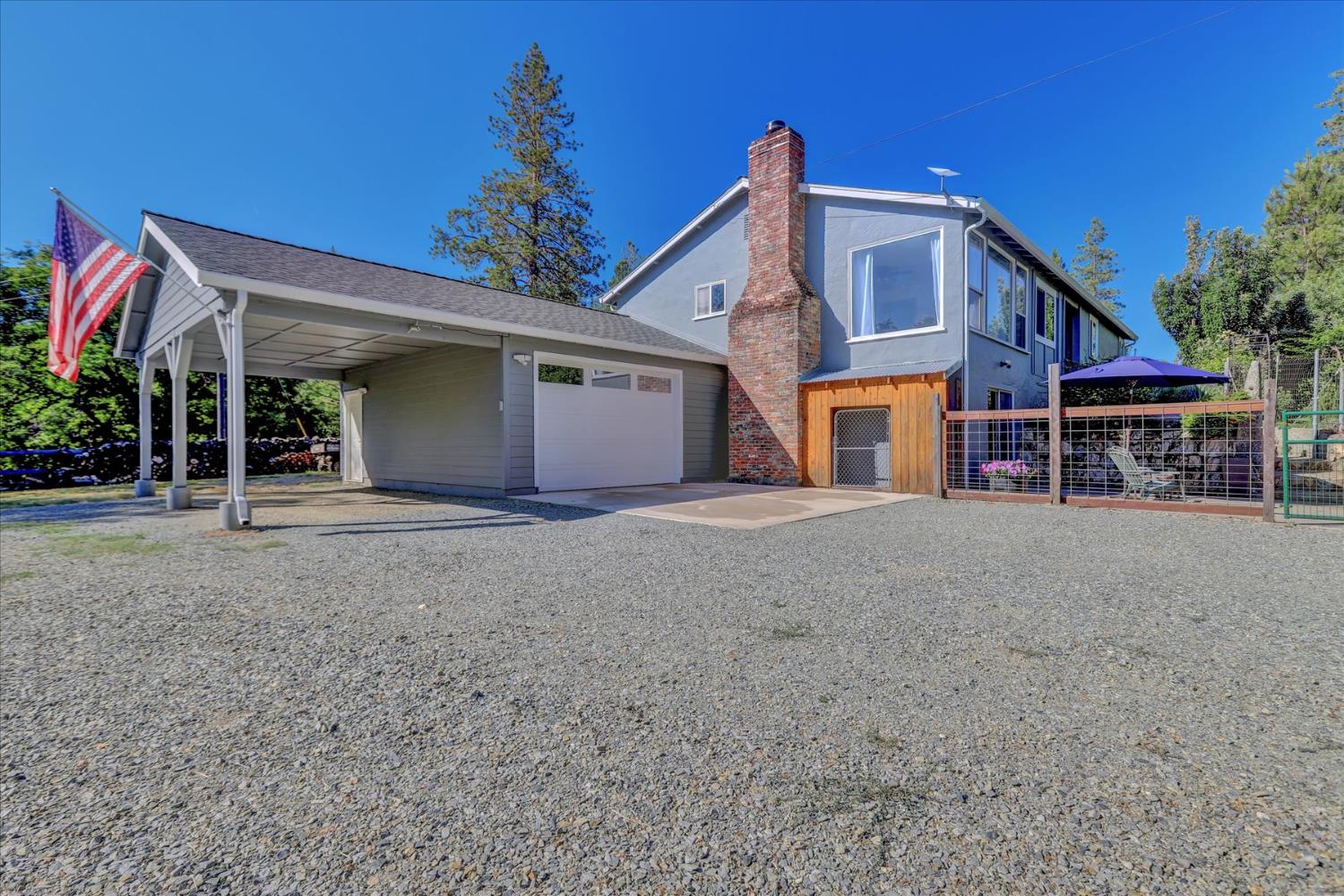 11625 Tyler Foote Road Nevada City, CA 95959 - Photo 72 of 96 a view of a house with a yard and potted plants