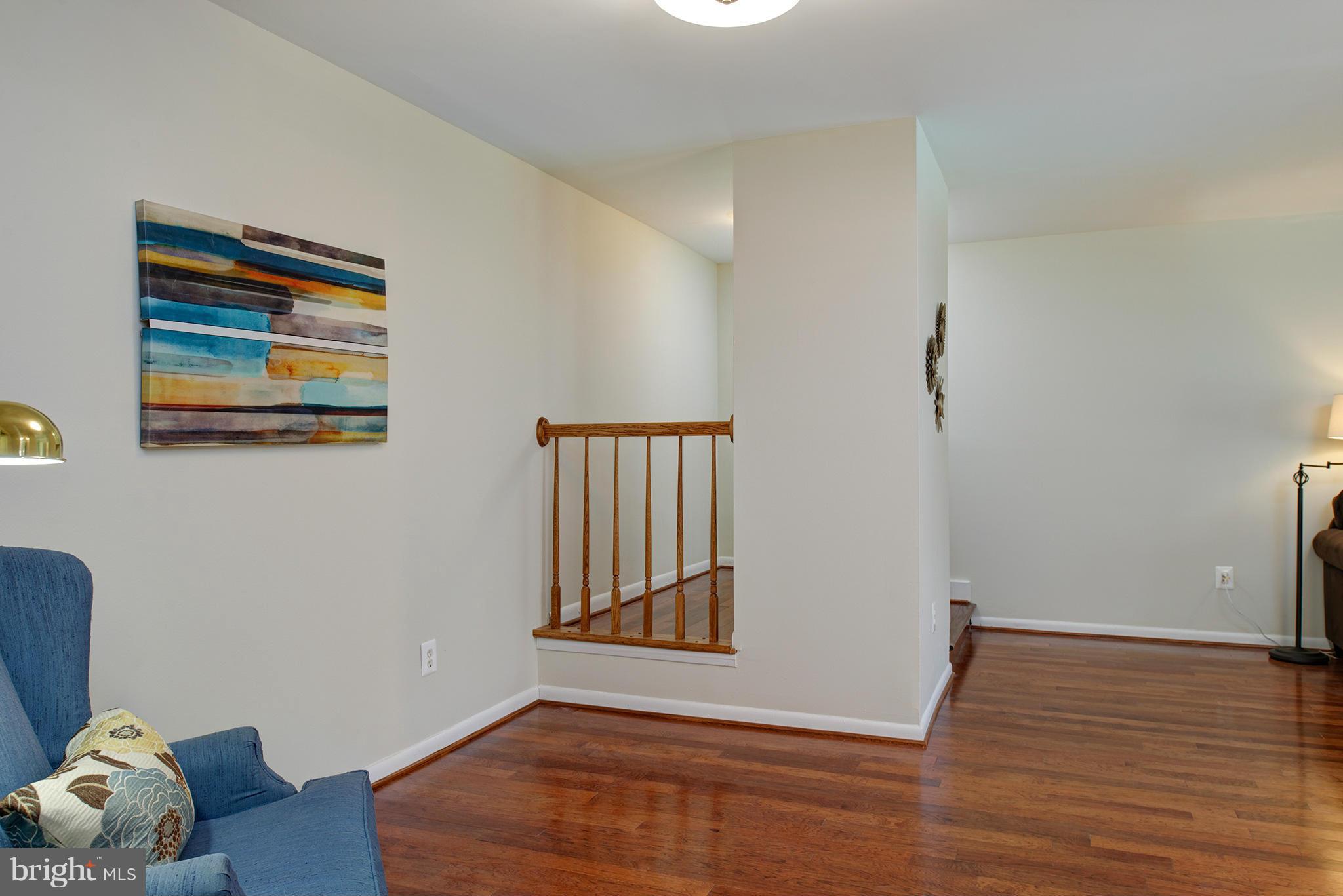 11232 Chestnut Grove Square, Unit 133 Reston, VA 20190 - Photo 6 of 29 Foyer & Family Room