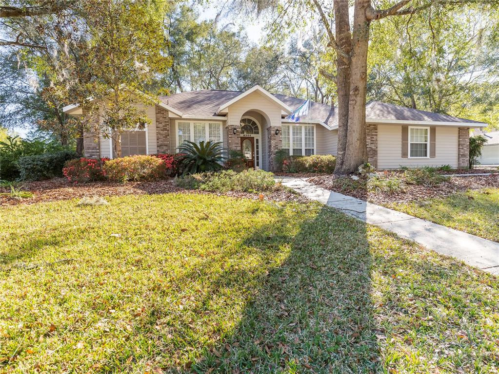 8305 Southwest 16 Place Gainesville, FL 32607 - Photo 1 of 1 a front view of a house with garden