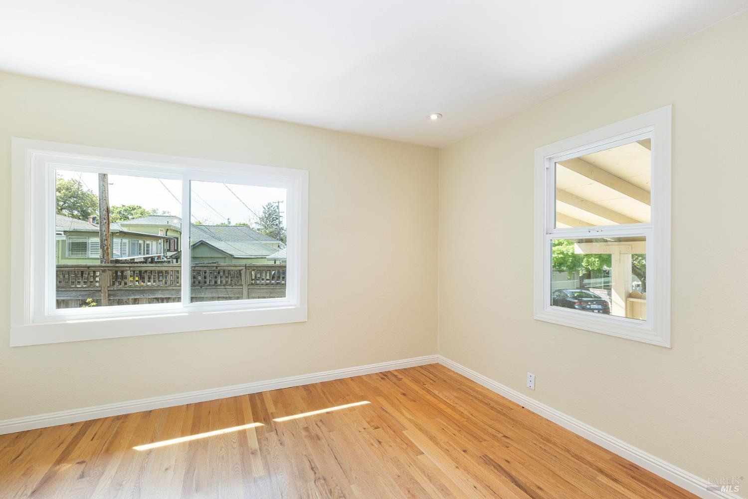 18090 Las Lomas Road Sonoma, CA 95476 - Photo 22 of 37 a view of an empty room with wooden floor and a window