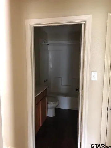 a bathroom with a glass shower door