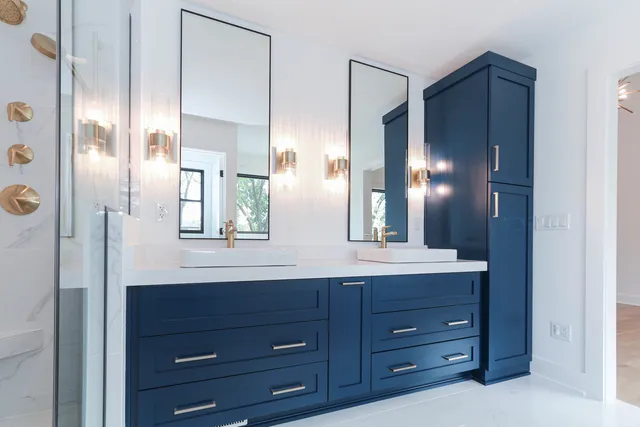 a bathroom with a double vanity sink and a mirror