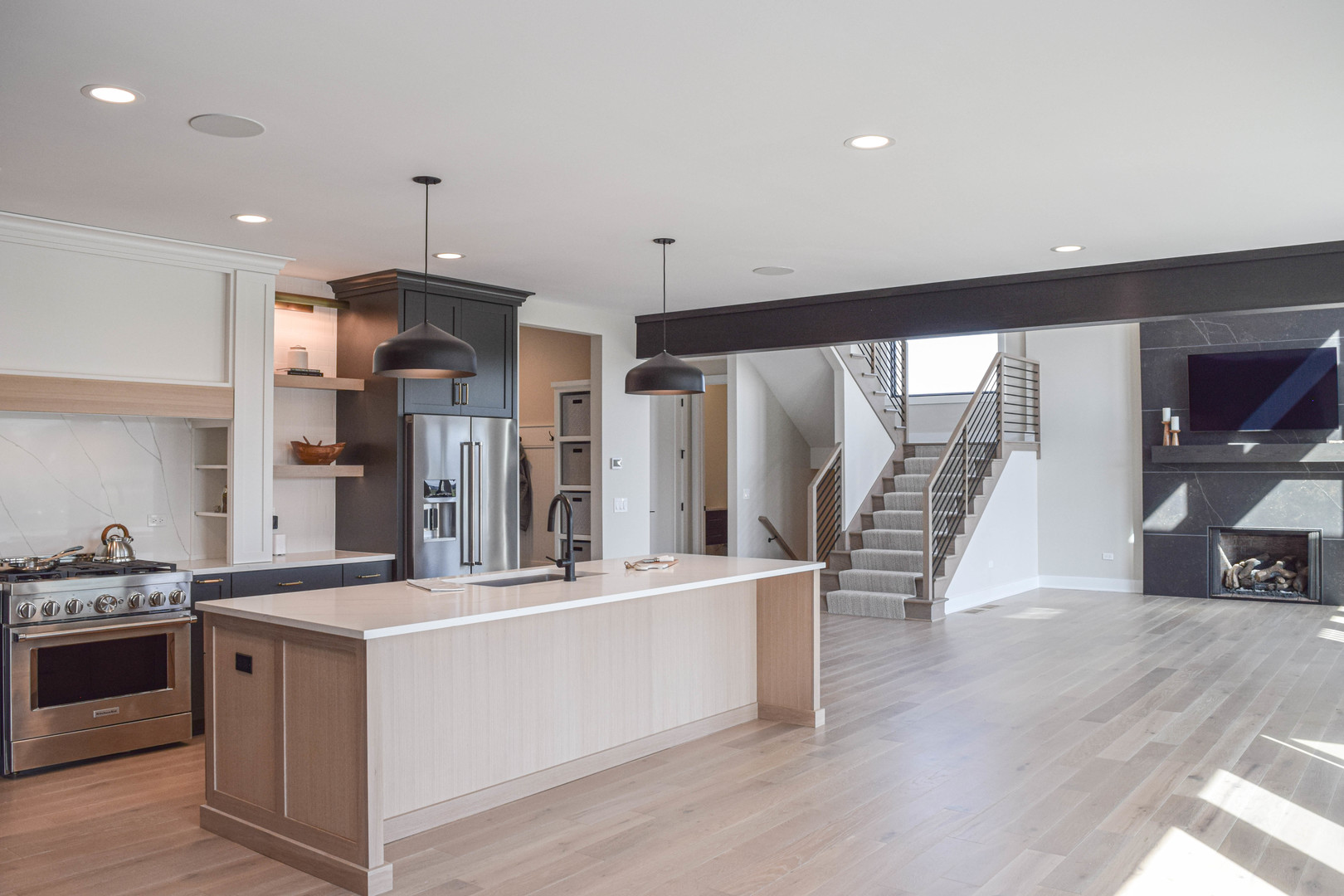 27-w151 48th Street Naperville, IL 60563 - Photo 7 of 22 a large kitchen with stainless steel appliances a large counter top a stove and a wooden floors