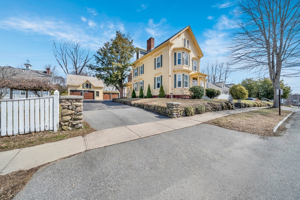 59 Washington Street Ipswich, MA 01938 - Photo 1 of 42 a front view of a house with a yard