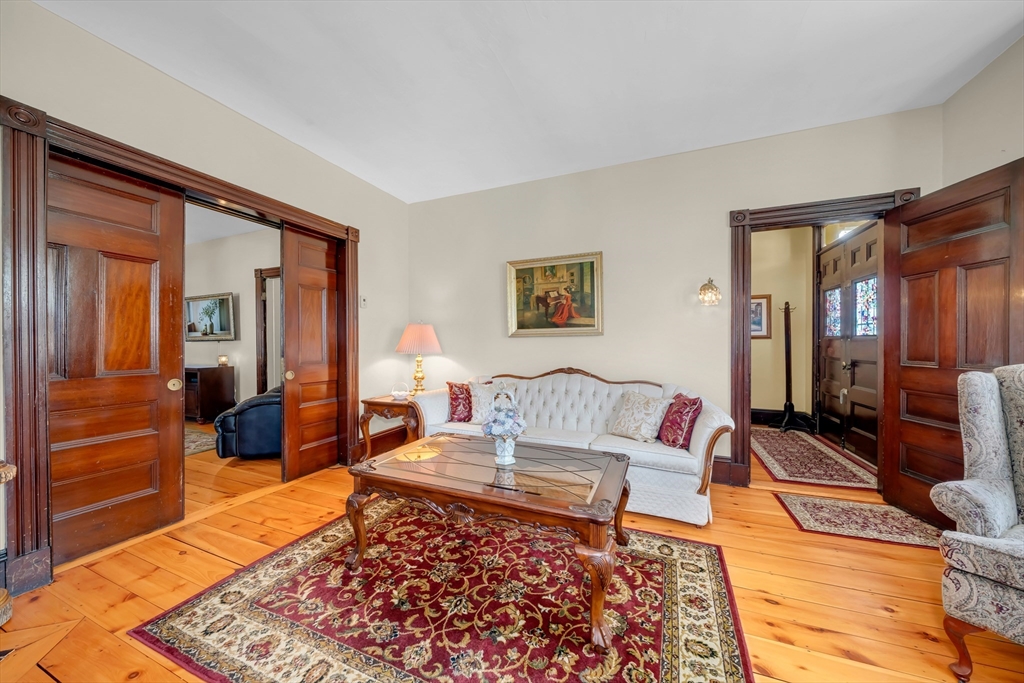 59 Washington Street Ipswich, MA 01938 - Photo 13 of 42 a living room with furniture and a rug