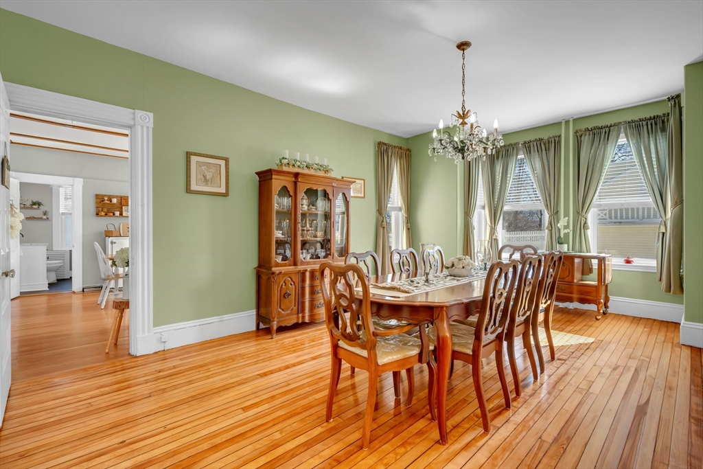59 Washington Street Ipswich, MA 01938 - Photo 16 of 42 a view of a dining room with furniture window and wooden floor